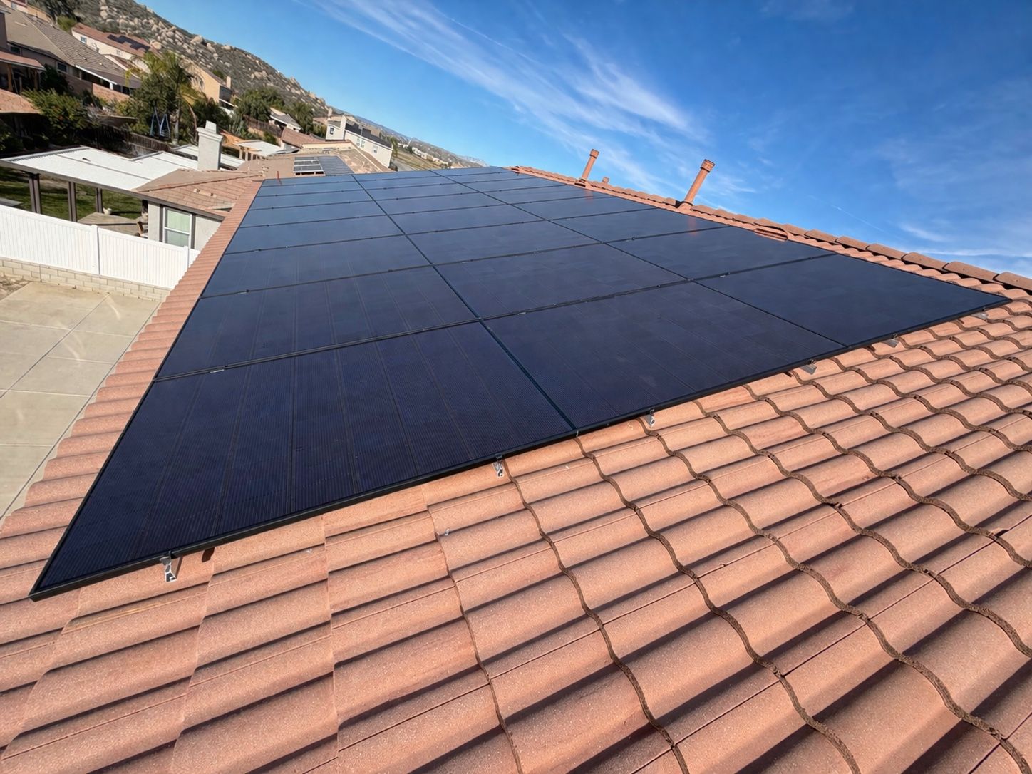 A completed GreeMpower residential rooftop solar installation on a Southern California home